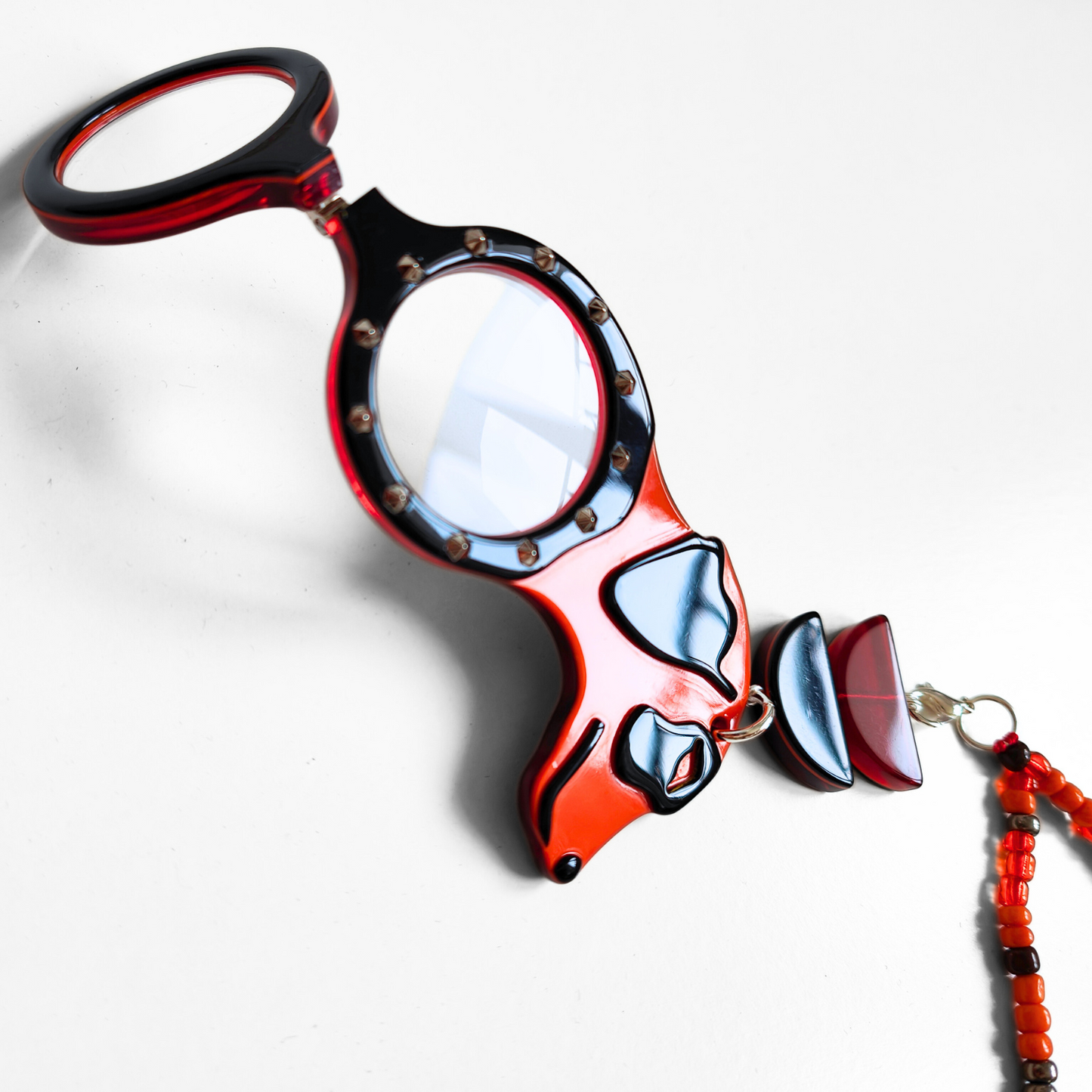 COLGANTE-LENTES PERRO PUNK NARANJA FL00481C